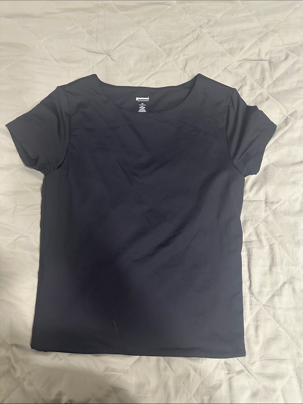 Junior’s tight fitting, slick black tee